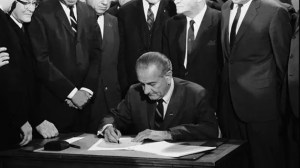 President Johnson signs the Civil Rights Act into Law